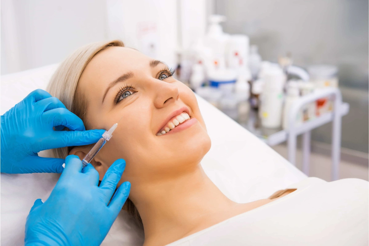 Woman receiving Sculptra treatment for facial collagen restoration